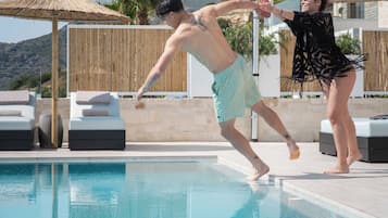 2 outdoor pools, a heated pool, pool umbrellas, pool loungers