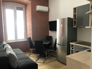 Standard Apartment | Living area | 110-cm Smart TV with digital channels, TV - Tony's Apartments (Rijeka)