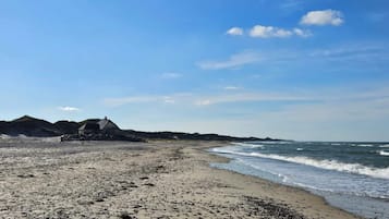 A beach with a building in the background.