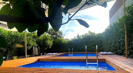 Outdoor pool. Sky & Green Luxury Apartment
