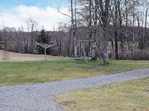 A park with a swing set and a metal sculpture. - 11 Person Holiday Home in Hogsater (Högsäter)