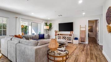 House, Multiple Beds, Pool Access, Garden View | Living area | 40-inch TV with digital channels