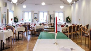 A spacious dining hall with multiple tables set for a formal event, featuring a central aisle and a high ceiling with exposed beams. - 5 Person Holiday Home in Hovborg (Hovborg)