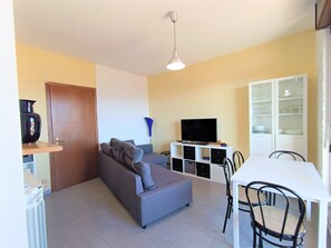 Apartment | Living area | 40-inch flat-screen TV with cable channels, TV
