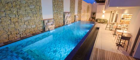 Outdoor pool, open 9:00 AM to 9:00 PM, pool loungers