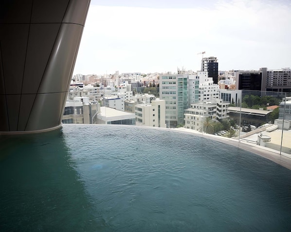 A view of a cityscape with modern buildings and a body of water. - Saffron Suite | Retreat with Skyline Views & Pool (Nicosia)