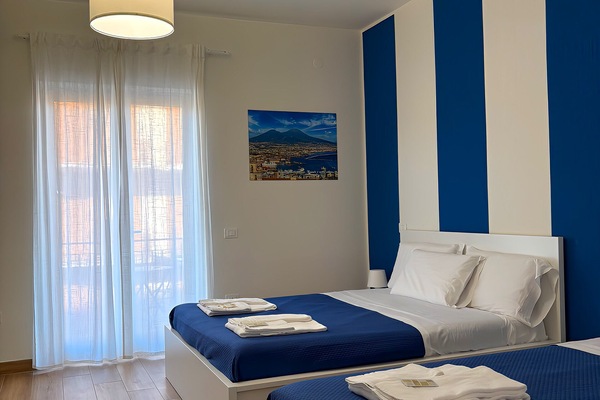 Deluxe Quadruple Room | Premium bedding, memory foam beds, individually furnished, desk