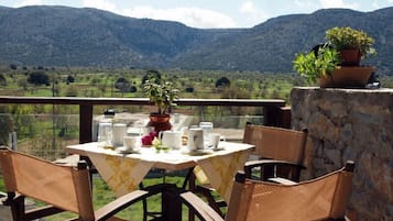 Enjoy al fresco dining on this scenic terrace overlooking rolling hills and the countryside.