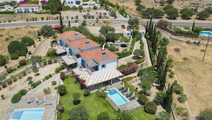 A villa with multiple bedrooms, a swimming pool, and a well-maintained garden. - Villa Aqua Maris by Villa Plus (Rhodes)
