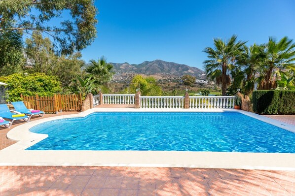 Relax by the pool with a breathtaking view of the surrounding mountains.
