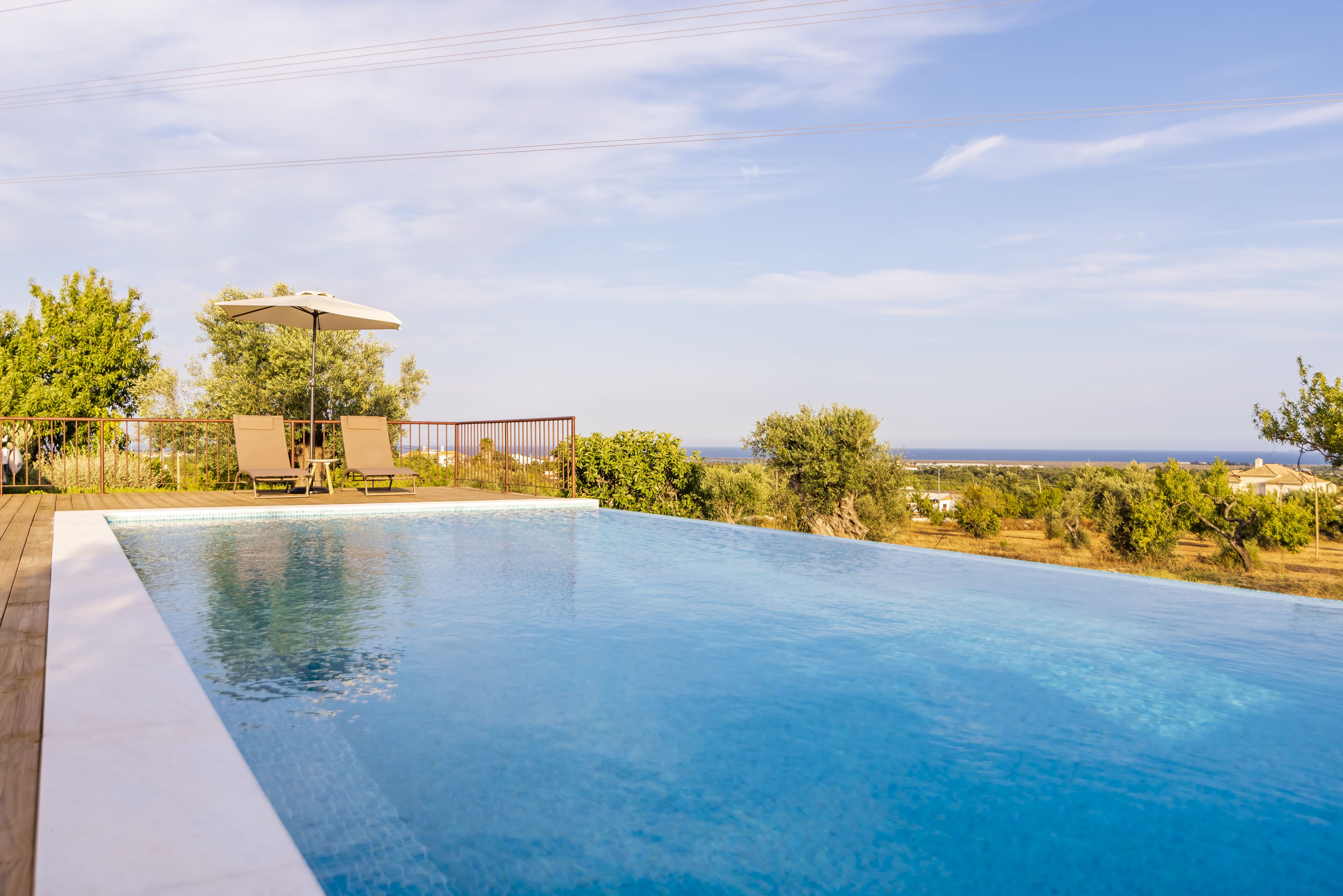 Seasonal outdoor pool, pool umbrellas, sun loungers