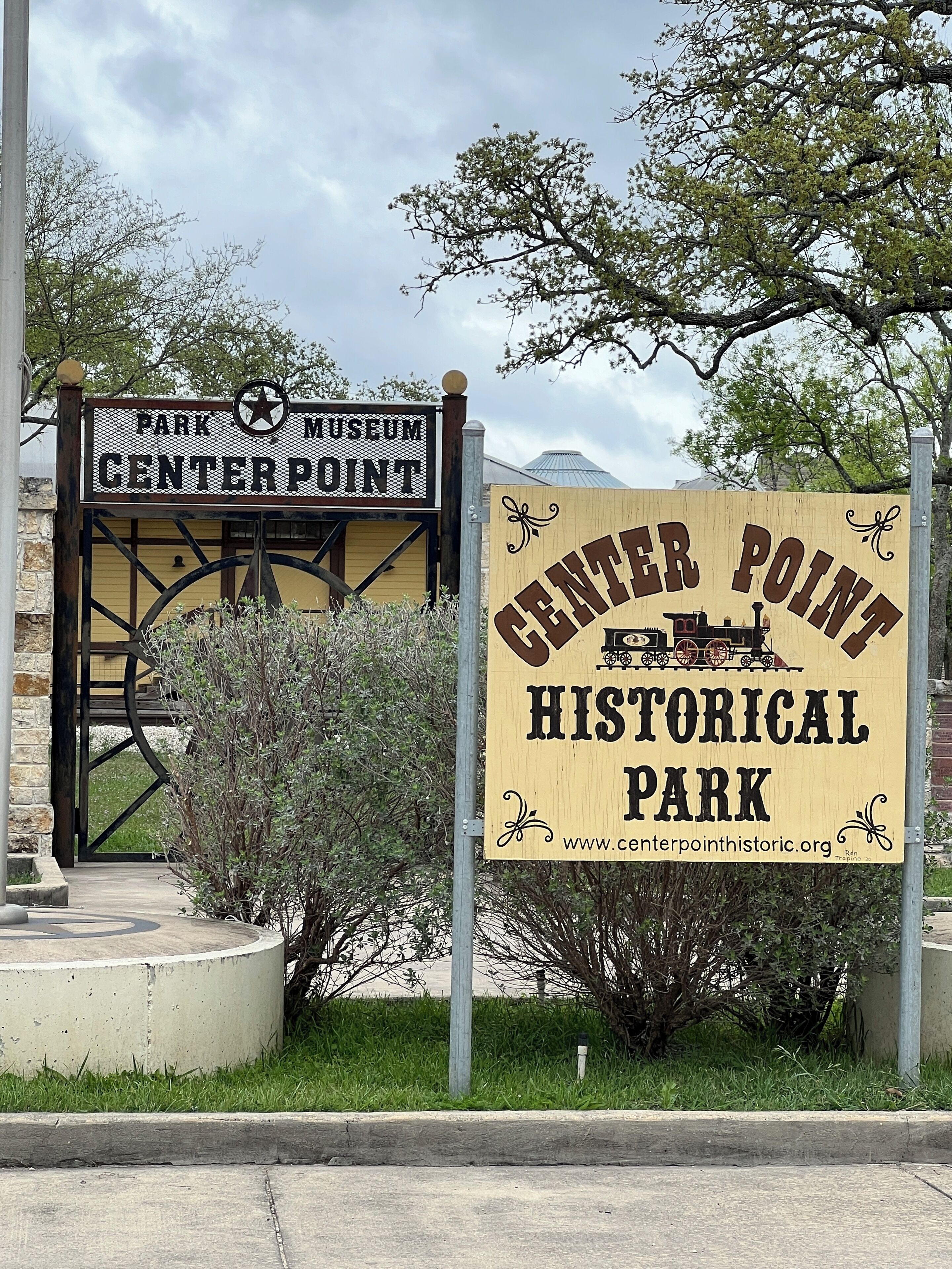 A sign for Center Point Historical Park with a train illustration and a website URL.