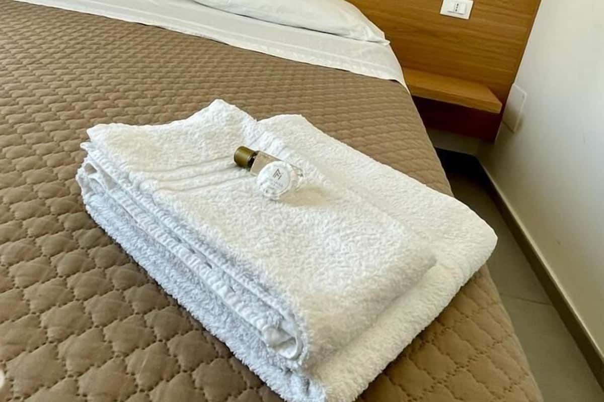 Desk, laptop workspace, free WiFi, bed sheets