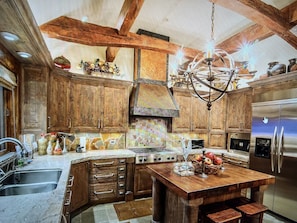 Enjoy cooking and dining in this well-equipped kitchen with a large island and ample workspace.
