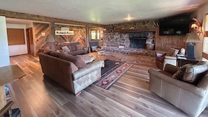 A cozy living room with a stone fireplace, leather sofas, and a wooden floor. - Exclusive Mountain Grandeur!
Back door to the Seven Devils Mountain range (Council)