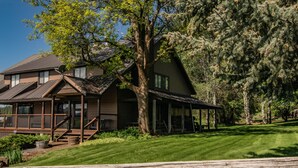 A two-story log cabin with a porch and a covered outdoor seating area. - Exclusive Mountain Grandeur!
Back door to the Seven Devils Mountain range (Council)