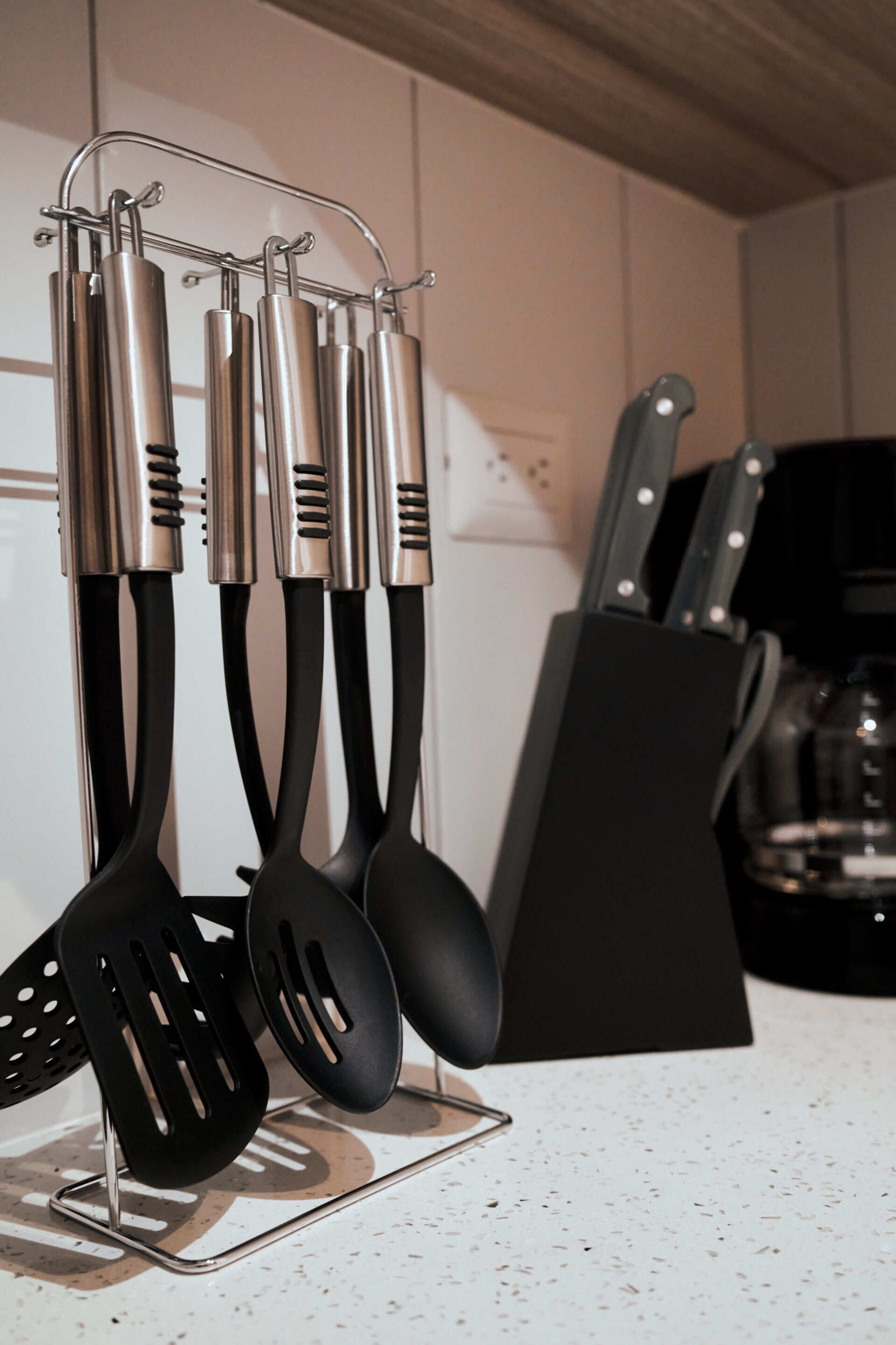 A kitchen utensil holder with various kitchen tools.