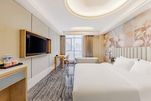 A hotel room with a bed, a desk, a television, a bathtub, and a large window with curtains. - Homeinn Ripple Yun Hotel (Hefei Xueji Road) (Hefei)