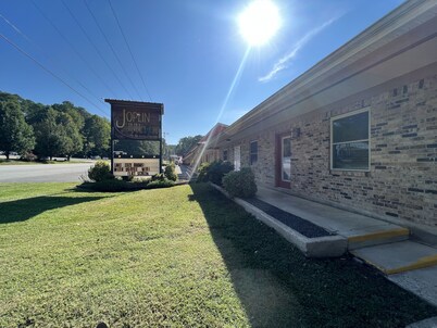 Queen Guest Room located at the Joplin Inn at the entrance to Mountain Harbor,, just 2 1/2 miles from Lake Ouachita. by RedAwning
