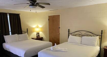 Queen Guest Room located at the Joplin Inn at the entrance to Mountain Harbor, just 2 1/2 miles from Lake Ouachita. by RedAwning