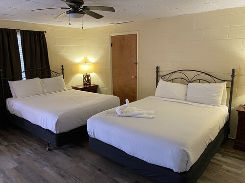 Queen Guest Room located at the Joplin Inn at the entrance to Mountain Harbor, , just 2 1/2 miles from Lake Ouachita. by RedAwning