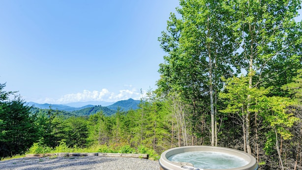 A hot tub in a natural setting with a view of mountains and trees. - Bryson City Cabin Rental w/ Views & Hot Tub (Bryson City)