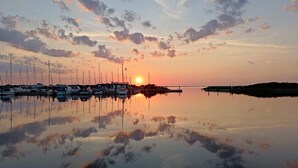 A marina with boats docked at sunset. - 4 Person Holiday Home in Hemmet (Hemmet)