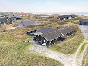 A coastal residential area with houses surrounded by dunes. - 10 Person Holiday Home in Lokken (Lokken)