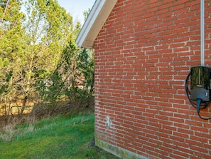 A brick building with a solar panel mounted on the side. - 4 Star Holiday Home in Romo (Rømø)
