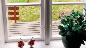 A window with a view of a grassy yard and a wooden fence. - 6 Person Holiday Home in Finnas-by Traum (Bomlo)