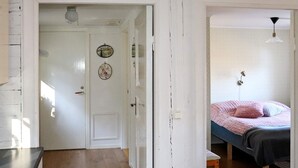 A bedroom with a bed, a bedside table, and a lamp. - 5 Person Holiday Home in Fjaras (Fjärås)