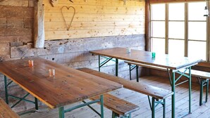 A rustic wooden interior with benches and a wall adorned with animal skulls. - 5 Person Holiday Home in Fjaras (Fjärås)