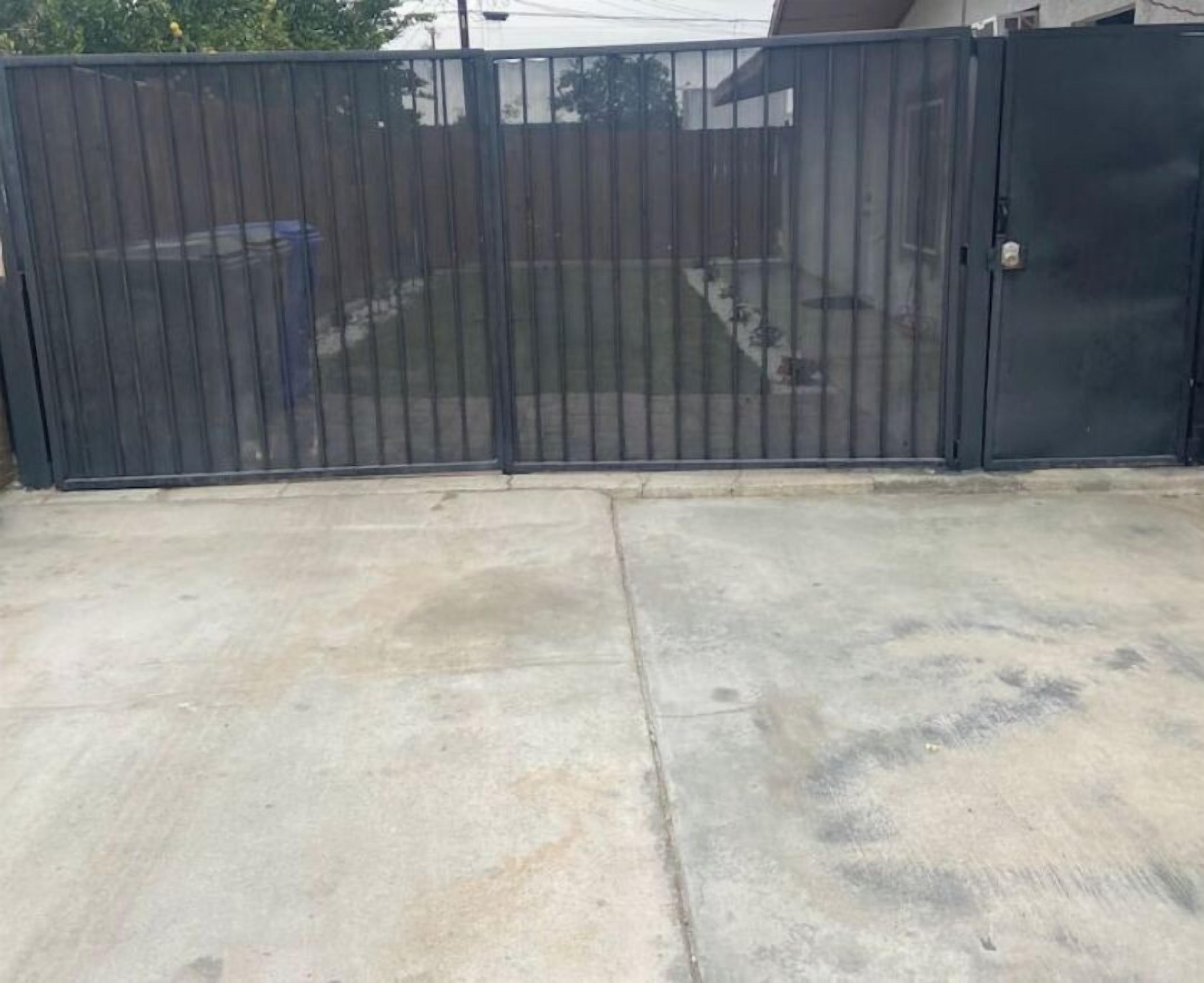 A gated area with a concrete surface.