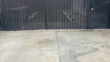 A gated area with a concrete surface.