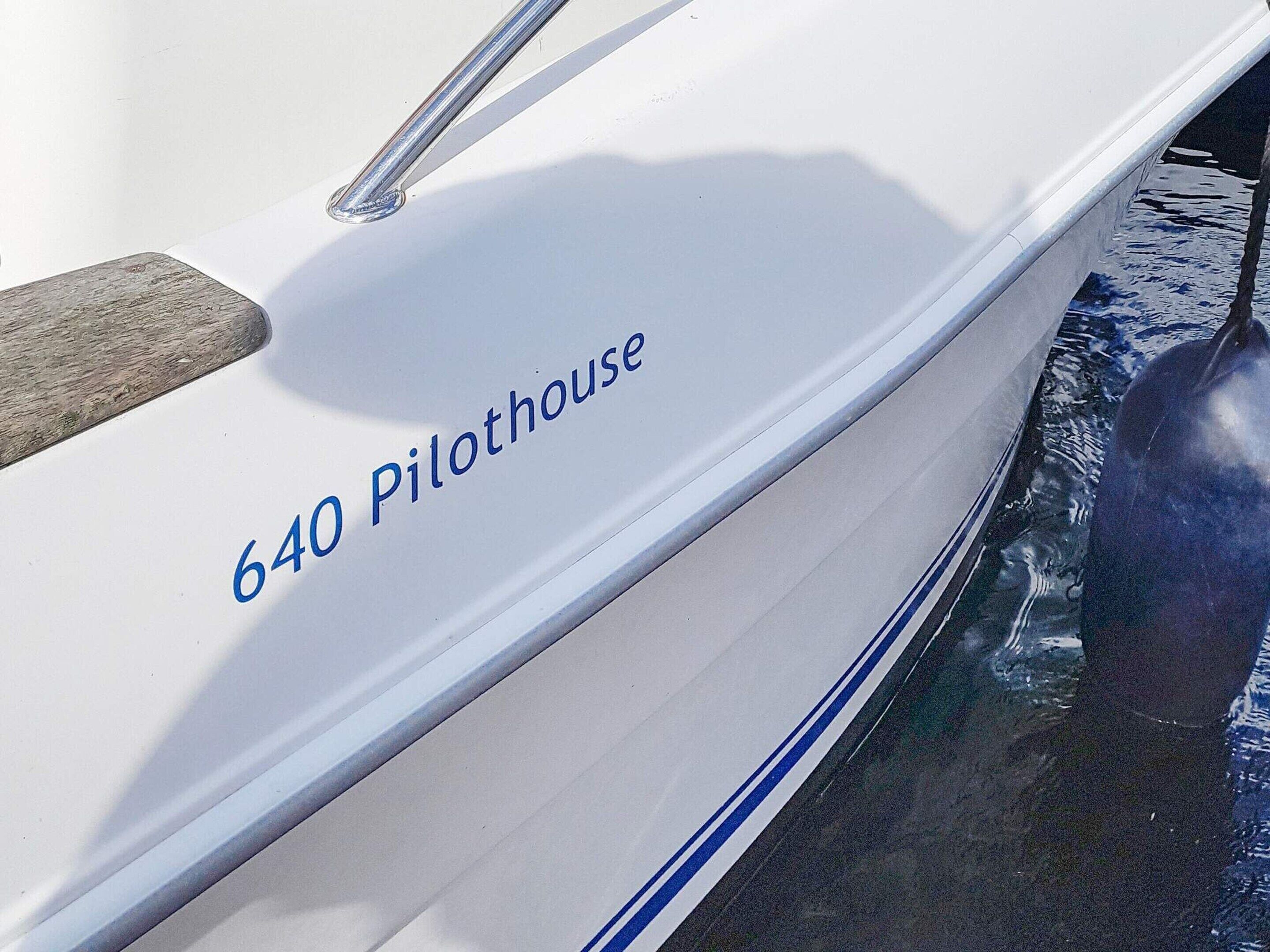 A boat with the number 640 Pilothouse on its side.