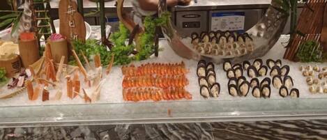 A seafood display with various types of fish and seafood arranged on ice.