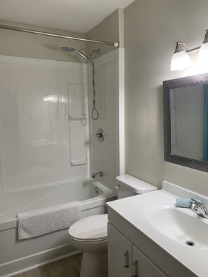 Bathtub, hair dryer, towels
