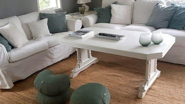 A living room with a white sofa set, a white coffee table, and green cushions. - 4 Star Holiday Home in Langshyttan (Langshyttan)