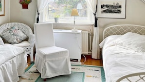 A room with a bed, a chair, a desk, and a radiator. - 4 Star Holiday Home in Varmdo (Värmdö)