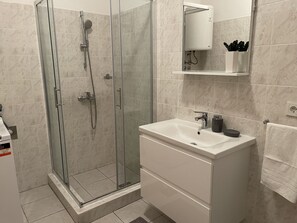 Shower, hair dryer, towels, soap