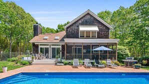 A two-story house with a swimming pool, a covered patio, and a barbecue area. - Southampton Family Summer (Southampton)