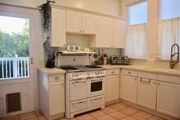 Microwave, coffee/tea maker, toaster oven, cookware/dishes/utensils