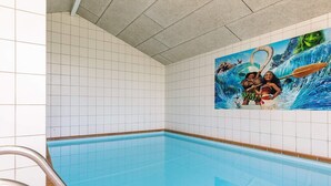 A swimming pool with a mural of animated characters on the wall. - 14 Person Holiday Home in Vaeggerlose (Vaeggerlose)