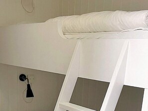 A white bed with a pillow and a white headboard. - 5 Person Holiday Home in Salen (Salen)