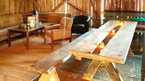 A rustic wooden interior with a long dining table, a sofa, and a chair. - 8 Person Holiday Home in Leinoy-by Traum (Heroy)