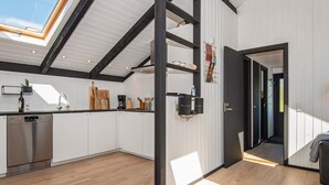 A modern kitchen with white cabinets, a dishwasher, and a skylight. - 4 Person Holiday Home in Hejls (Hejls)