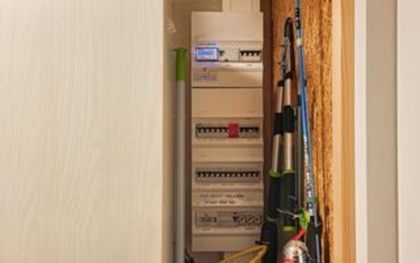 A utility room with electrical panels and wiring. - 4 Star Holiday Home in Ringkobing (Ringkobing)