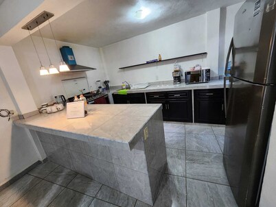 Cozy 2-bedroom apartment in nice Los Reyes Acaquilpan with WiFi