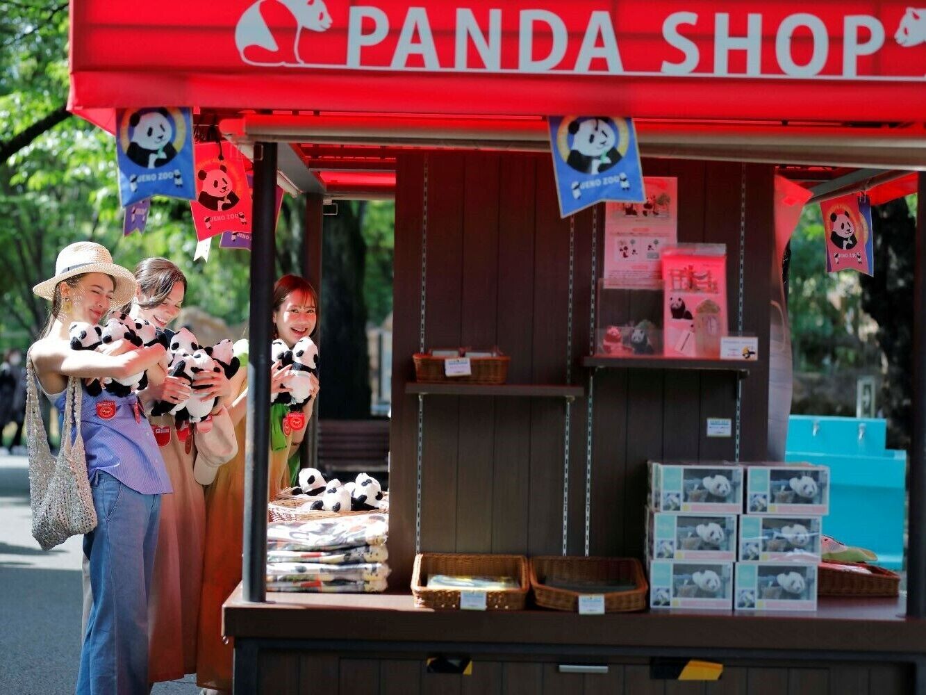 A panda-themed shop with merchandise like plush toys and boxes.