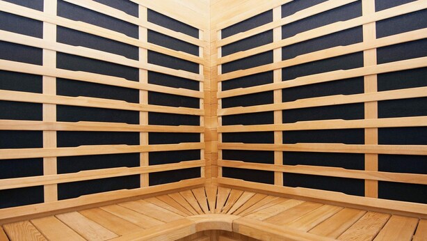 A corner of a room with a wooden slatted ceiling and floor, creating a geometric pattern. - 14 Person Holiday Home in Ebeltoft-by Traum (Ebeltoft)